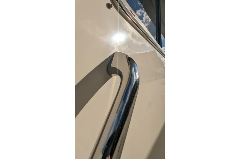 Slide: The Image of Close-up of 2005 Kadey-Krogen Pilothouse yacht railing reflecting sunlight. - 22