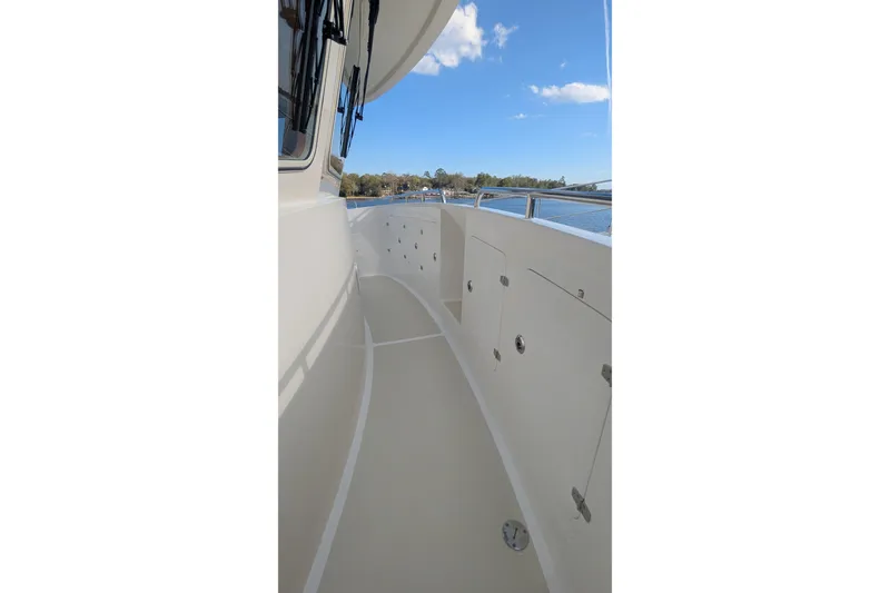 Slide: The Image of 2005 Kadey-Krogen Pilothouse yacht deck with scenic water view. - 24