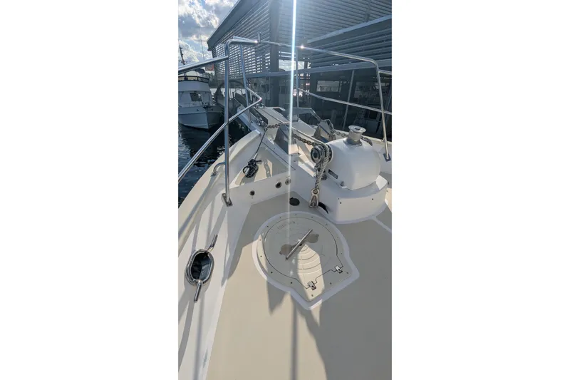 Slide: The Image of 2005 Kadey-Krogen Pilothouse boat deck with anchor chain and winch system. - 28