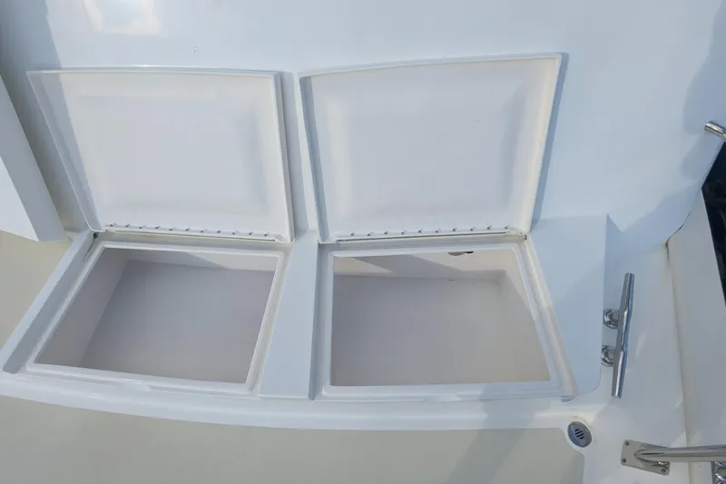 Slide: The Image of Open storage compartments on a 2005 Kadey-Krogen Pilothouse boat deck. - 29