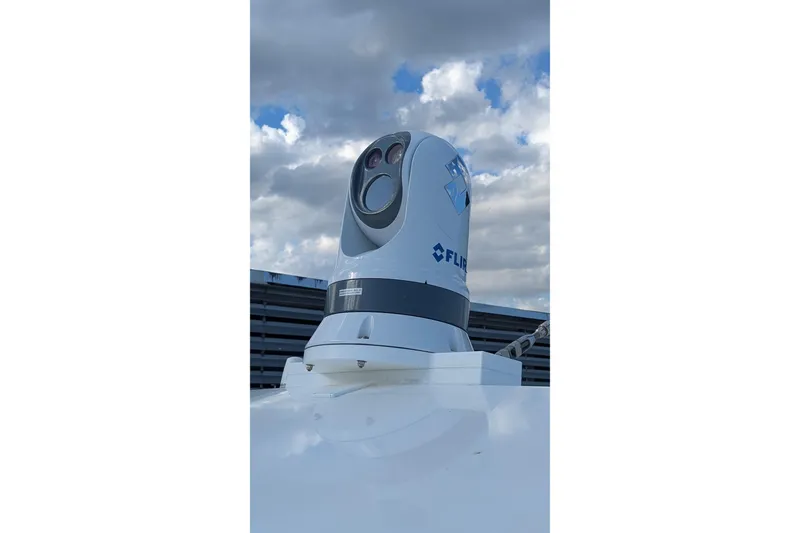 Slide: The Image of FLIR camera on 2005 Kadey-Krogen Pilothouse under cloudy sky. - 33