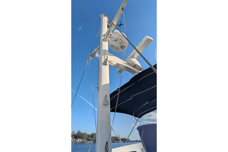 Slide: The Image of 2005 Kadey-Krogen Pilothouse mast and radar against clear blue sky. - 41