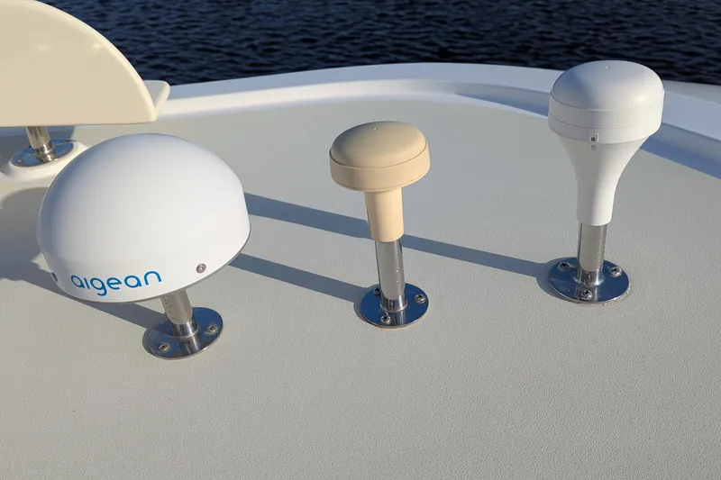Slide: The Image of Three marine antennas on a 2005 Kadey-Krogen Pilothouse boat deck. - 48