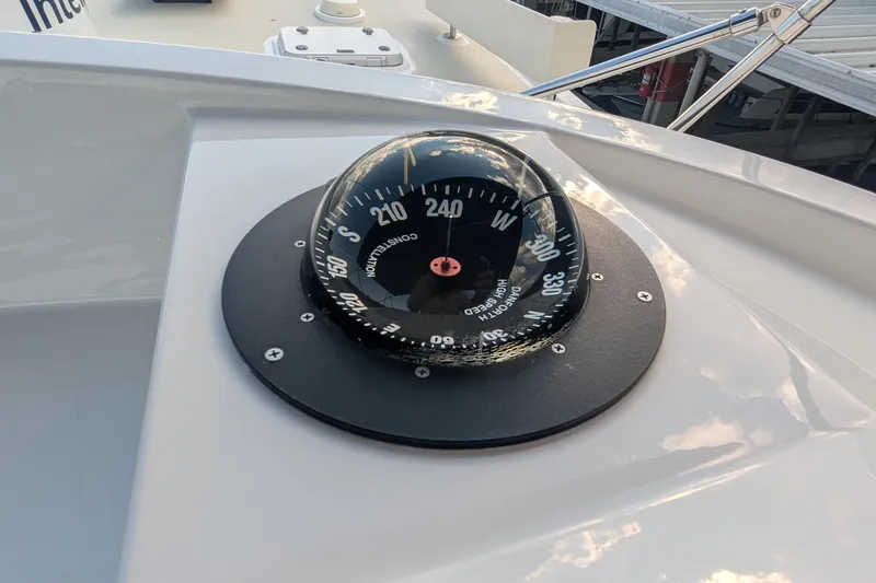 Slide: The Image of 2005 Kadey-Krogen Pilothouse compass on deck, showcasing navigation equipment. - 52