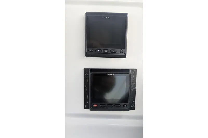 Slide: The Image of Garmin navigation displays on 2005 Kadey-Krogen Pilothouse boat dashboard. - 53