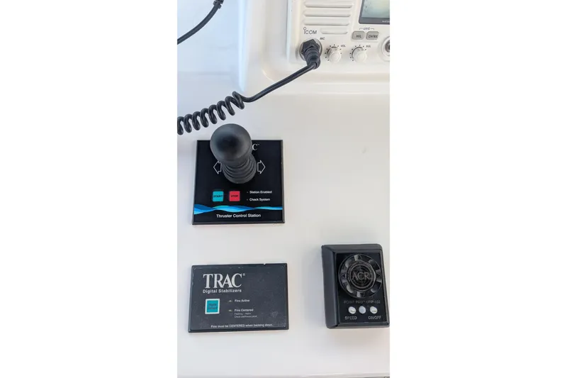 Slide: The Image of Kadey-Krogen Pilothouse 2005 control panel with thruster joystick and digital stabilizers. - 57