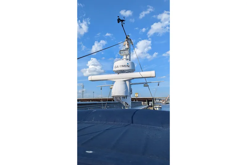 Slide: The Image of 2005 Kadey-Krogen Pilothouse with Garmin radar against blue sky. - 58