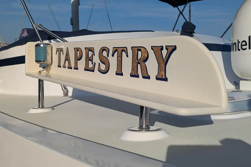 Slide: The Image of 2005 Kadey-Krogen Pilothouse boat with "Tapestry" nameplate, close-up view. - 62