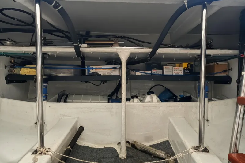 Slide: The Image of 2005 Kadey-Krogen Pilothouse interior with storage shelves and equipment. - 66