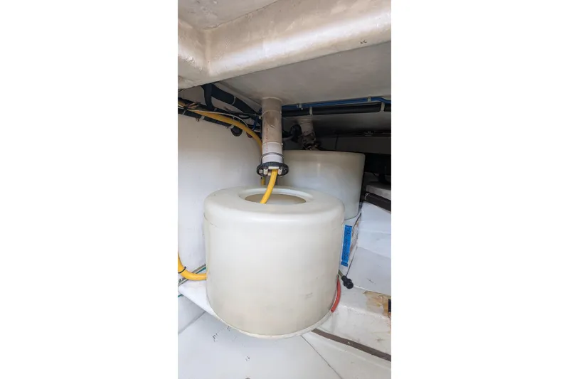 Slide: The Image of 2005 Kadey-Krogen Pilothouse interior showing storage tanks and piping system. - 68