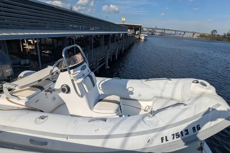 Slide: The Image of 2005 Kadey-Krogen Pilothouse boat docked by marina, sunny day, calm water. - 7