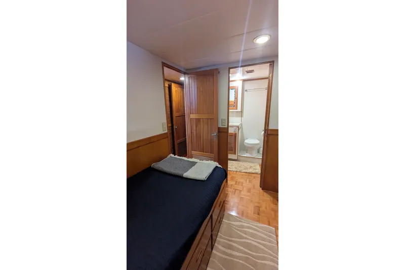 Slide: The Image of 2005 Kadey-Krogen Pilothouse interior with cozy bedroom and ensuite bathroom. - 72
