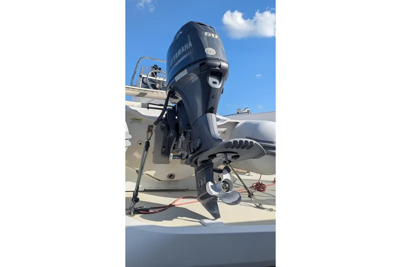 Slide: The Image of 2005 Kadey-Krogen Pilothouse with Yamaha outboard motor under clear blue sky. - 9