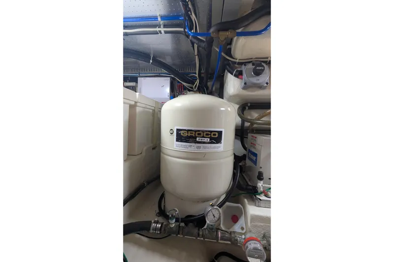 Slide: The Image of Engine room of 2005 Kadey-Krogen Pilothouse with Groco equipment and piping. - 98