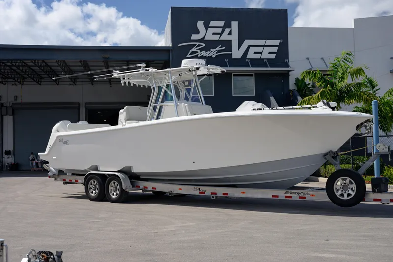 The Image of 2021 SeaVee 322Z boat on trailer outside SeaVee Boats facility. - 1