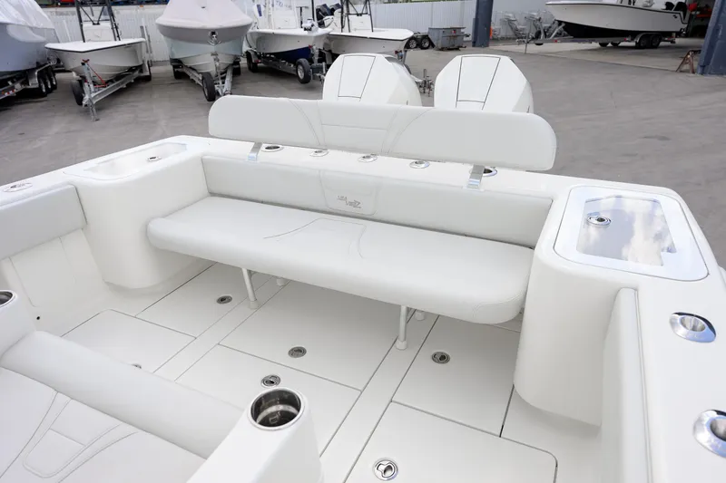 Slide: The Image of 2021 SeaVee 322Z boat interior with white seating and storage compartments. - 10