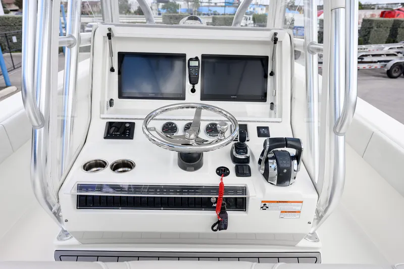 Slide: The Image of 2021 SeaVee 322Z boat console with dual screens, steering wheel, and controls. - 15