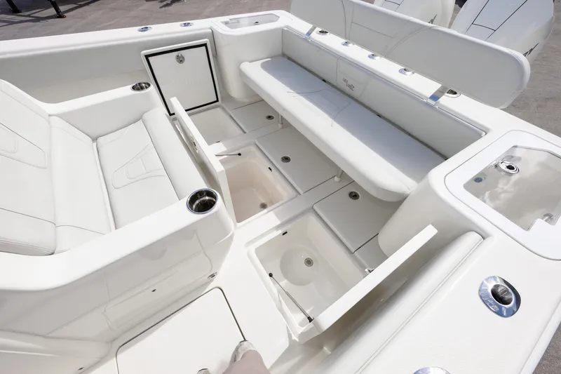 Slide: The Image of 2021 SeaVee 322Z boat interior with white seating and storage compartments. - 16