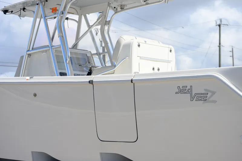 Slide: The Image of 2021 SeaVee 322Z boat, sleek design with modern console and logo. - 6