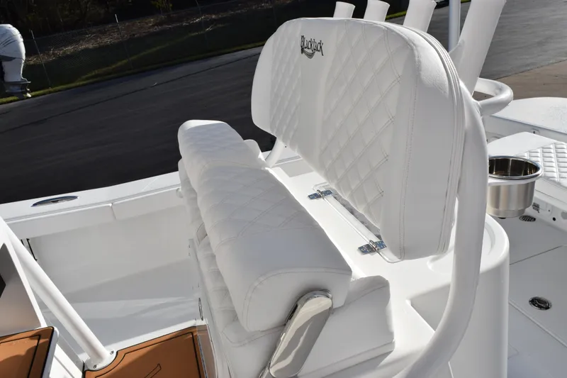Slide: The Image of Luxurious seating on 2026 BlackJack 256 Coastal boat with diamond-stitched upholstery. - 10
