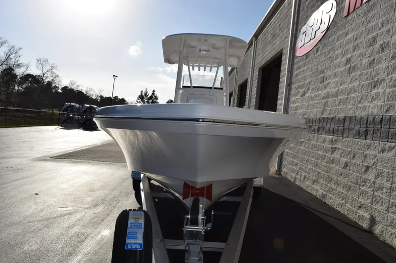 Slide: The Image of 2026 BlackJack 256 Coastal boat on trailer, parked outside a building under a clear sky. - 3