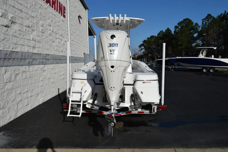 Slide: The Image of 2026 BlackJack 256 Coastal boat with powerful 300 V6 engine, parked outdoors. - 5