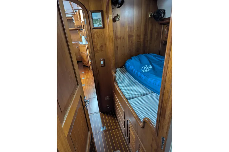 Slide: The Image of Navigation station of 1994 Passport Royal Passport 44 yacht with control panel and seating. - 19