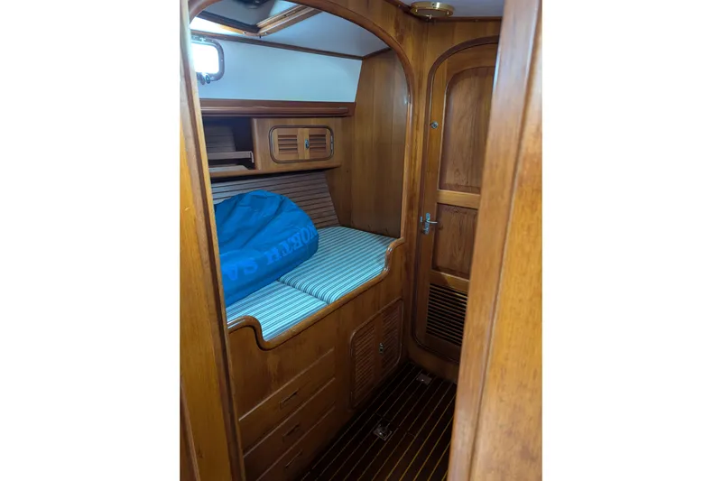 Slide: The Image of 1994 Passport Royal Passport 44 yacht bathroom with sink, mirror, and shower area. - 22