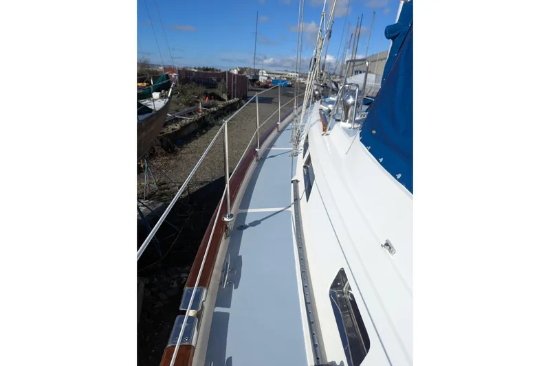 Slide: The Image of Sailboat deck view of 1994 Passport Royal Passport 44, featuring mast and rigging. - 4