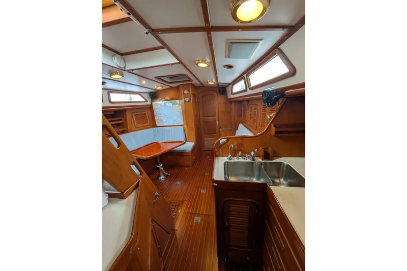 Slide: The Image of Cockpit of 1994 Passport Royal Passport 44 sailboat with blue canopy and wooden accents. - 8