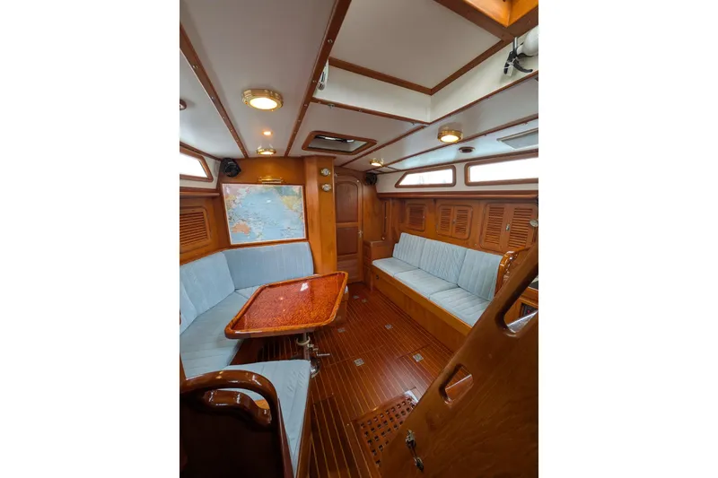 Slide: The Image of Interior of 1994 Passport Royal Passport 44 yacht with wood finish and compact kitchen area. - 9