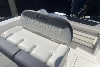 Slide: The Image of 2023 Trophy T24 CC boat interior with cushioned seating and backrest. - 10