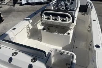 Slide: The Image of 2023 Trophy T24 CC boat interior with seating and storage compartments. - 7