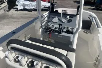 Slide: The Image of 2023 Trophy T24 CC boat interior with steering console and seating. - 8