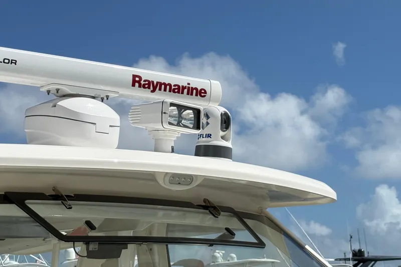 Slide: The Image of Boston Whaler 420 Outrage 2017 with Raymarine radar and FLIR camera under blue sky. - 21