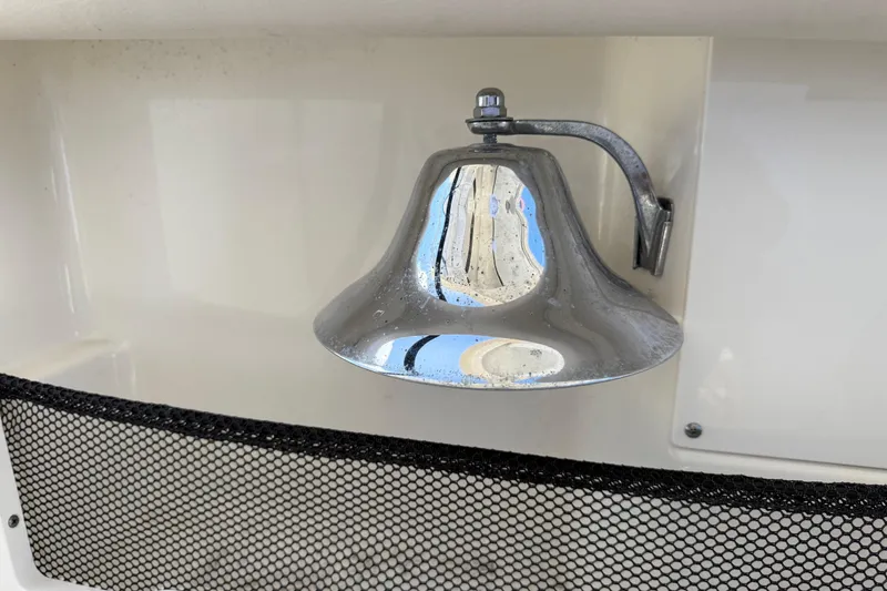 Slide: The Image of Chrome bell on 2017 Boston Whaler 420 Outrage boat, mounted on white surface. - 29