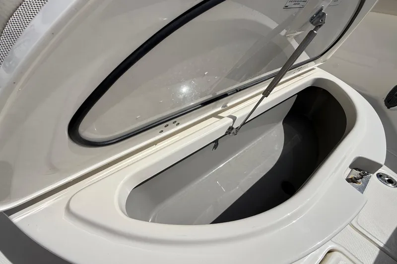 Slide: The Image of Open storage compartment on a 2017 Boston Whaler 420 Outrage boat. - 32