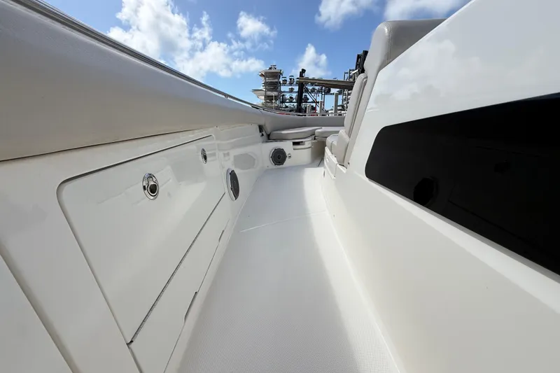 Slide: The Image of 2017 Boston Whaler 420 Outrage boat deck with sleek design under blue sky. - 39
