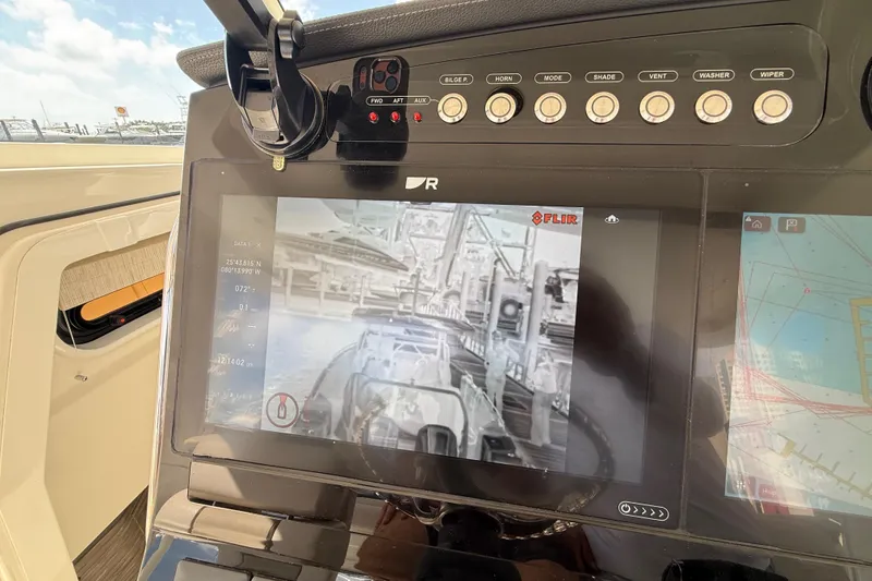Slide: The Image of 2017 Boston Whaler 420 Outrage dashboard with FLIR thermal imaging display. - 45