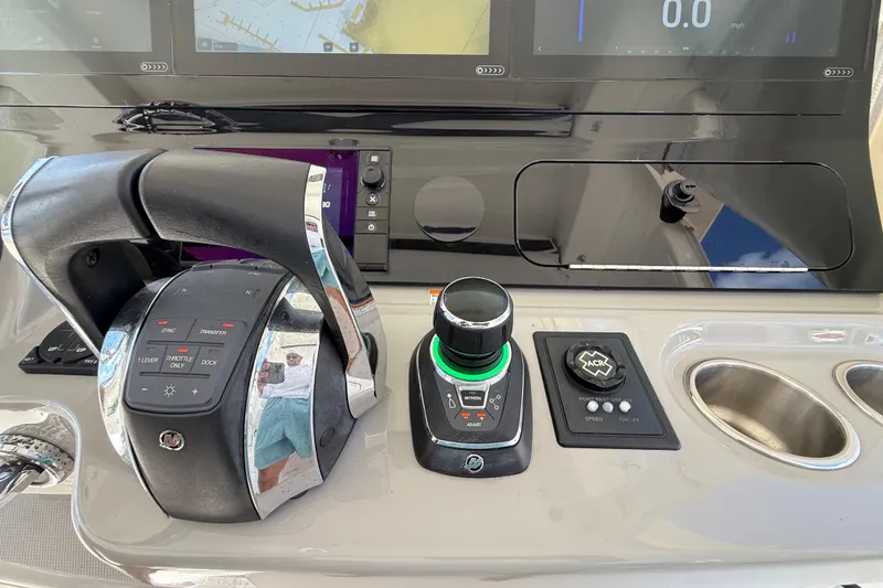 Slide: The Image of Control panel of a 2017 Boston Whaler 420 Outrage boat with advanced navigation features. - 46