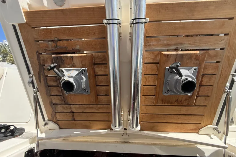 Slide: The Image of 2017 Boston Whaler 420 Outrage boat deck with wooden panels and metal fixtures. - 49