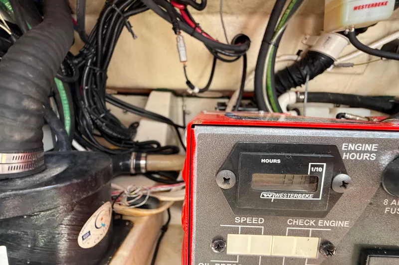 Slide: The Image of Engine compartment of a 2017 Boston Whaler 420 Outrage with Westerbeke engine hour meter. - 53