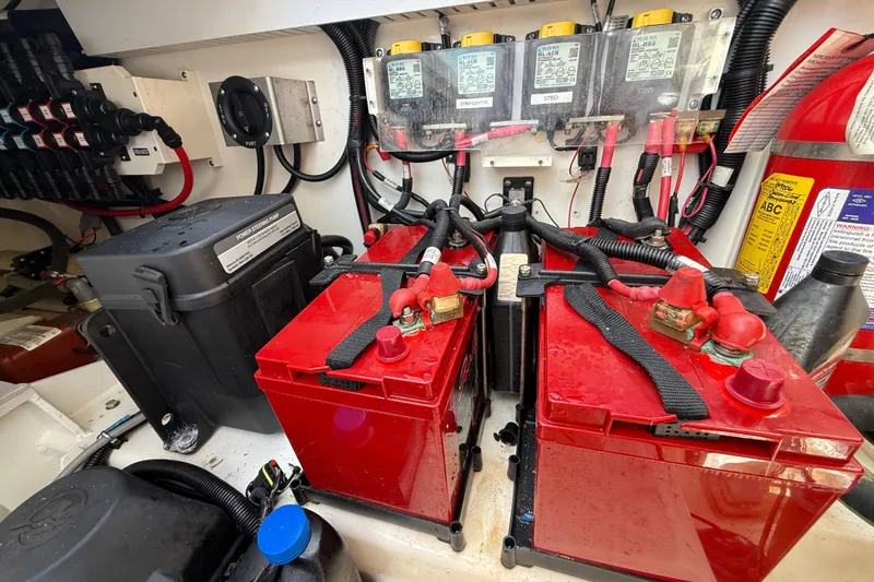 Slide: The Image of Electrical system of a 2017 Boston Whaler 420 Outrage, featuring batteries and wiring. - 54