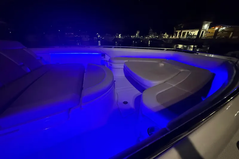 Slide: The Image of 2017 Boston Whaler 420 Outrage boat interior with blue LED lighting at night. - 7