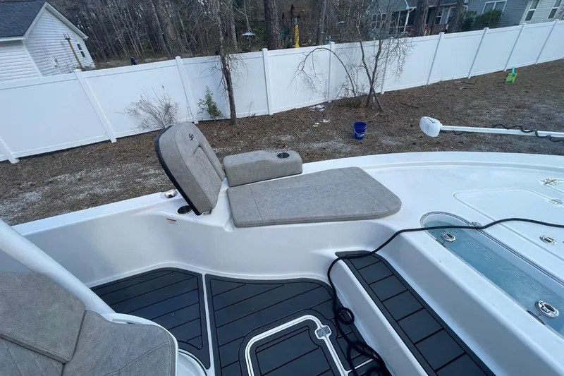 Slide: The Image of 2023 Sea Pro 248 Bay boat interior with seating and deck details. - 14