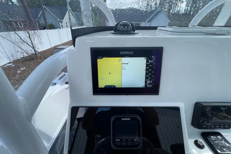 Slide: The Image of 2023 Sea Pro 248 Bay boat dashboard with Simrad navigation display. - 20
