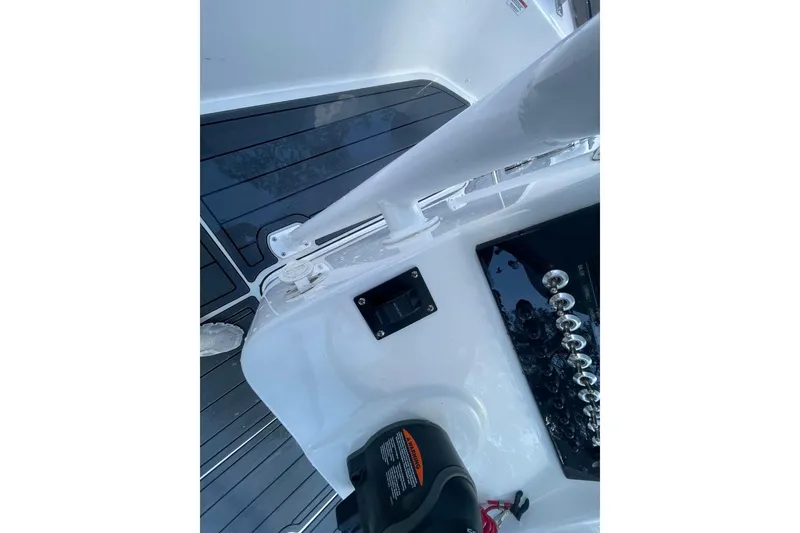 Slide: The Image of 2023 Sea Pro 248 Bay boat deck with control panel and sleek design. - 21