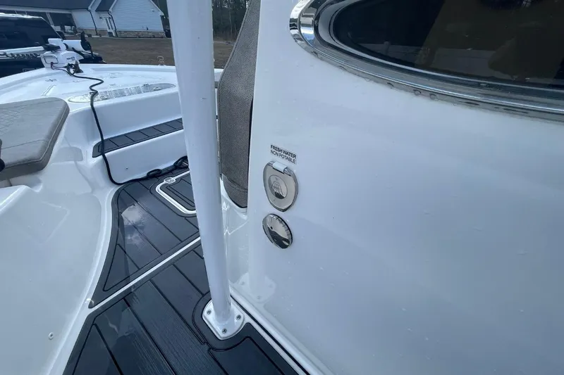 Slide: The Image of 2023 Sea Pro 248 Bay boat interior, featuring deck and water fill ports. - 22