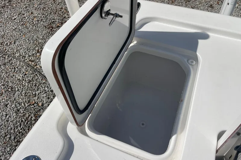 Slide: The Image of Open storage compartment on 2023 Sea Pro 248 Bay boat, showing interior space. - 29
