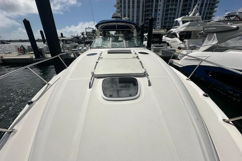 Slide: The Image of 2008 Sea Ray 340 Sundancer yacht docked at marina, surrounded by other boats. - 17